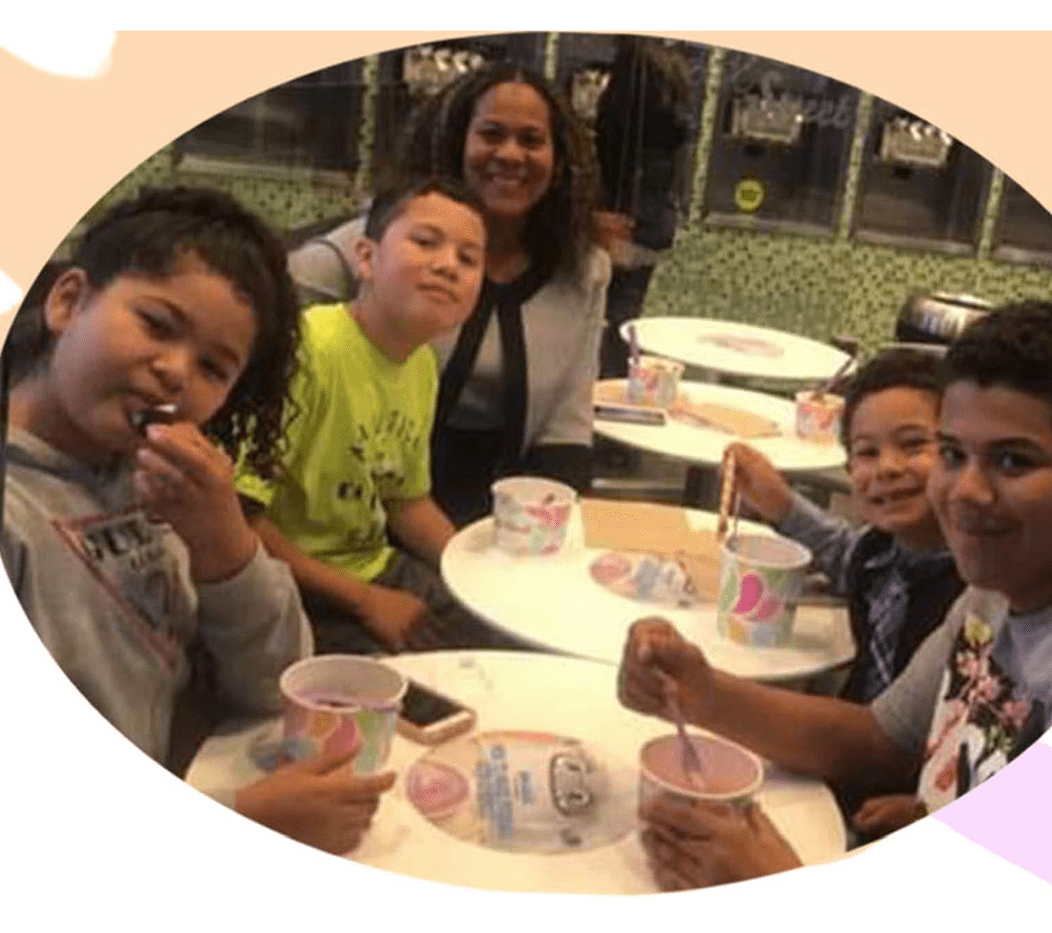 Azie's family sharing frozen yogurt around a table